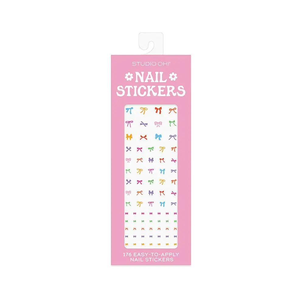 โStudio Oh Nail Sticker Sheetโ โ Flat lay of sticker pack with colorful nail polish bottles
โPeel and Stick Nail Artโ โ Close-up of vibrant stickers with bows