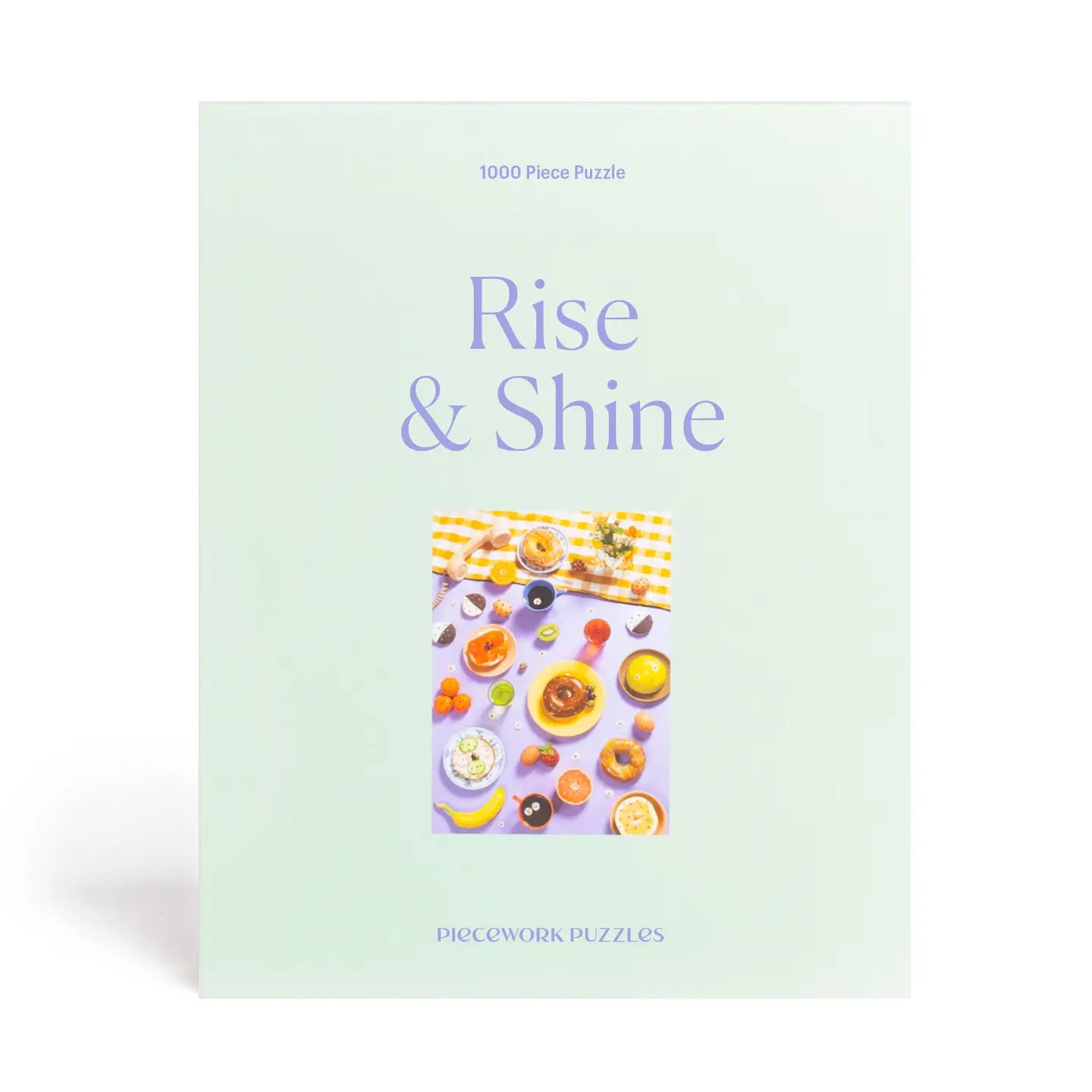 Puzzle box titled 'Rise & Shine' with a colorful breakfast scene on a light green background