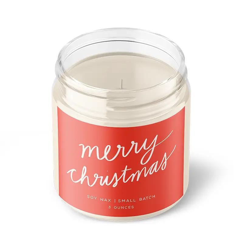 “Small amber jar candle labeled MERRY CHRISTMAS surrounded by ornaments and festive greenery.”
“Hand-poured soy candle burning beside wrapped gifts and holiday décor.”
“Flat lay of MERRY CHRISTMAS candle with pinecones, cinnamon sticks, and twinkle lights.”