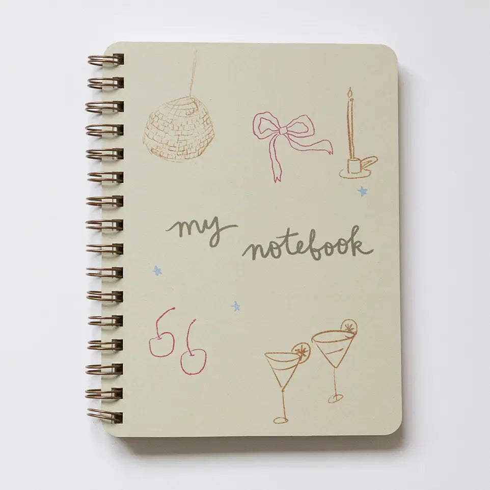 βDisco Bow Notebook Flat Layβ β Spiral notebook styled with glitter pens, lip gloss, and heart-shaped accessories
βCool Girl Stationeryβ β Close-up of notebook cover with bold disco bow design and spiral detail