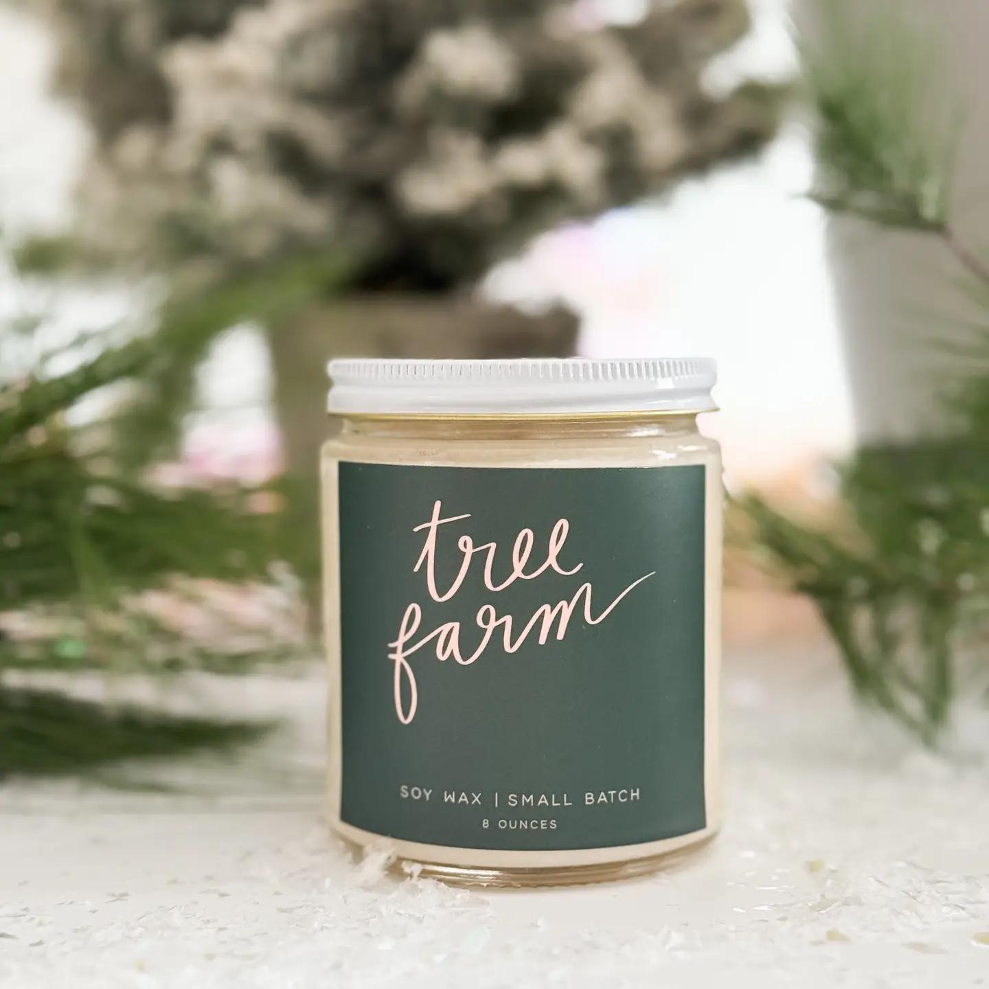 “Amber glass candle labeled TREE FARM surrounded by pine needles and ornaments.”
“Hand-poured soy candle burning beside evergreen branches and twinkle lights.”
“Tree Farm candle styled on a wooden tray with pinecones and a cozy blanket.”