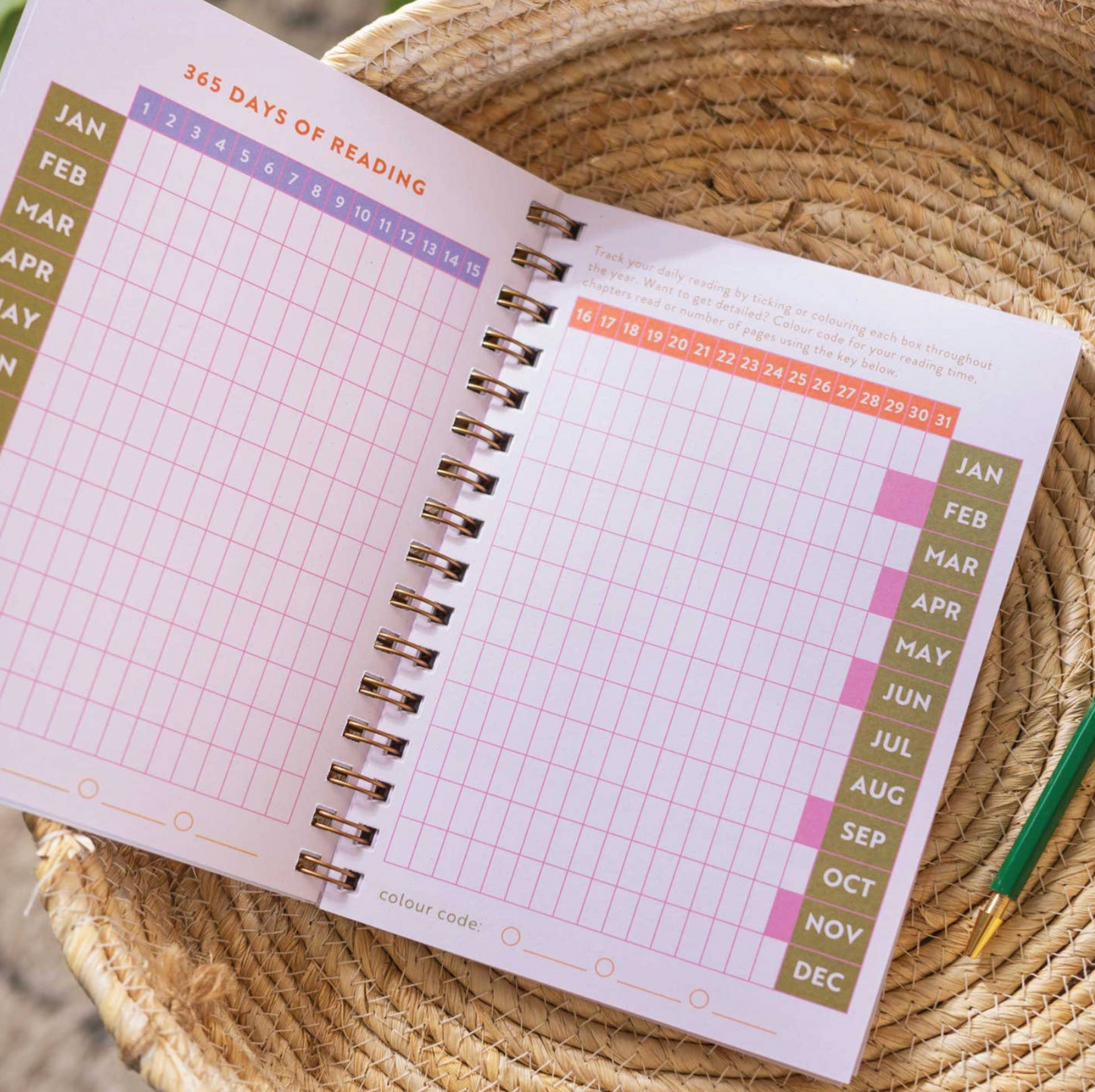 Open planner with monthly layout on a woven surface