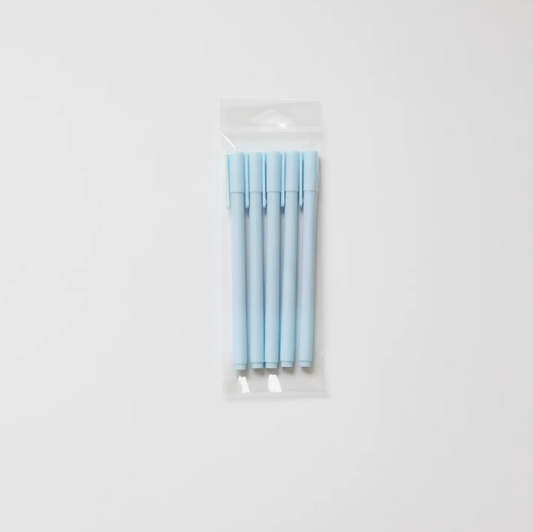 Set of light blue pens in a clear plastic package on a white background