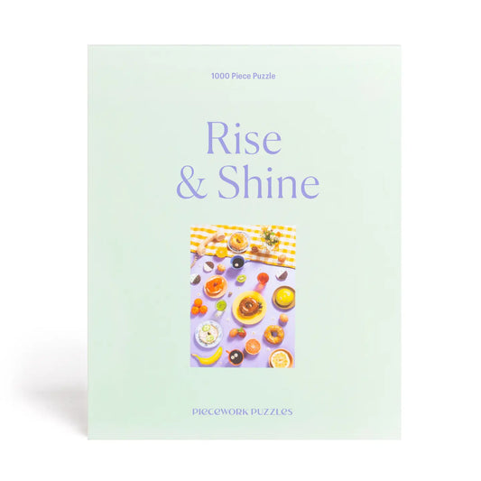 Puzzle box titled 'Rise & Shine' with a colorful breakfast scene on a light green background