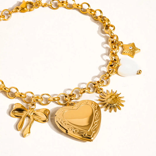 "Heart of Gold" – Bracelet styled on a pink satin background with roses

"Golden Hour Glow" – Close-up on wrist with other stacking bracelets and soft sunlight

"Locket Love" – Flatlay of bracelet with a vintage photo and handwritten note