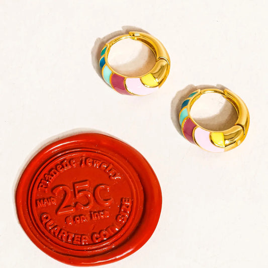 “Rainbow Luxe” – Close-up of colorful striped hoops on a soft pastel fabric background

“Playful Pop” – Earrings styled on a model with colorful makeup and layered jewelry

“Golden Color Burst” – Hoops displayed on a minimal earring stand with colorful shadows