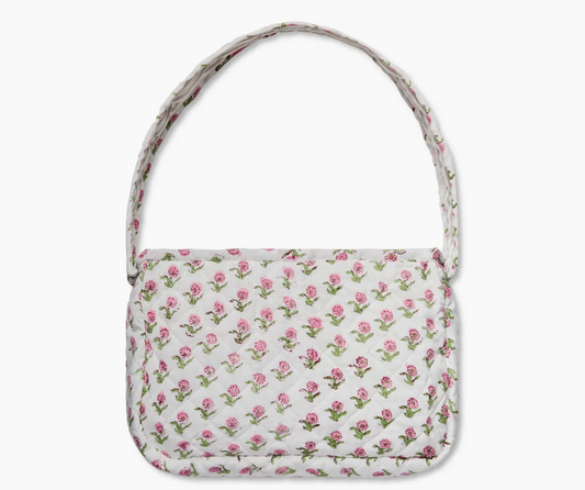 Small quilted shoulder bag in vibrant pink and green floral block print, lightweight cotton purse with zipper closure for daily use.