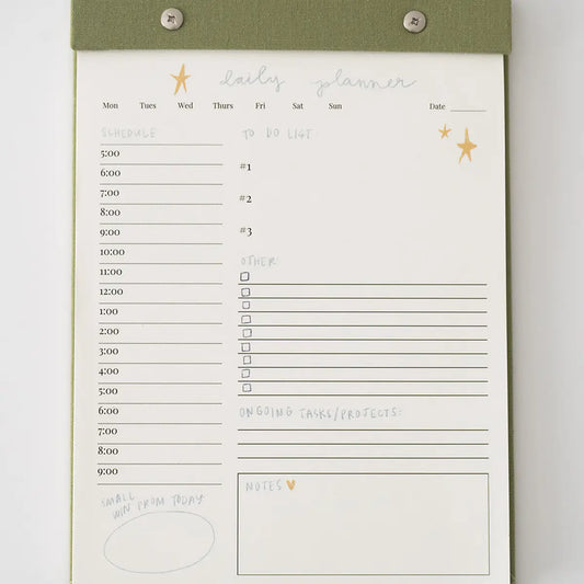 “Elegant Daily Planner Notepad” – Notepad with linen backing and silver hardware on a clean desk with pens

“Tear-Off Productivity Pad” – Page in use with to-do list filled in and planner accessories nearby