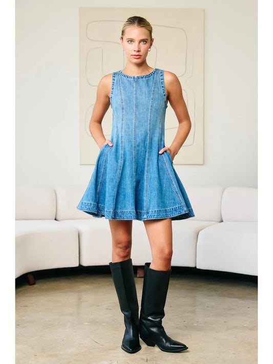 "Fall Layers Favorite" – Denim dress styled with a cream turtleneck and ankle boots

"Pocket Full of Pretty" – Close-up of side pocket detail on flared denim skirt

"Zip & Twirl" – Back view showcasing the zipper and flowy silhouette in motion