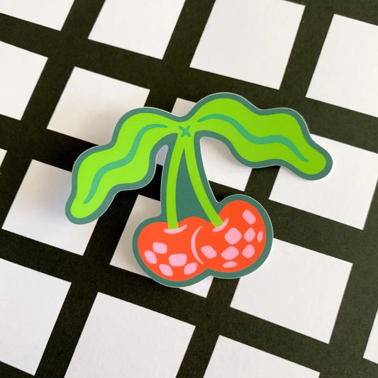 “Groovy Cherry” – Close-up of the disco cherry sticker showcasing matte finish and vibrant colors

“Funky Fresh” – Sticker on a retro-themed water bottle with fun disco lights background

“Sweet Beat” – Sticker on a notebook surrounded by colorful stationery