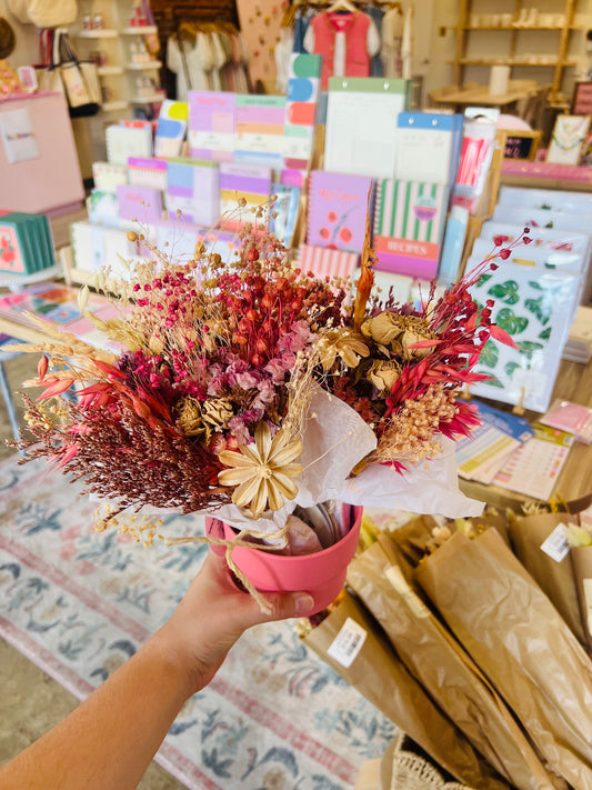 “Tangerine Mini Bouquet” – Dried flower bundle in warm yellow, peach, and orange tones wrapped in tissue

“Sunset Dried Flower Gift” – Close-up of colorful mini bouquet styled in a bud vase