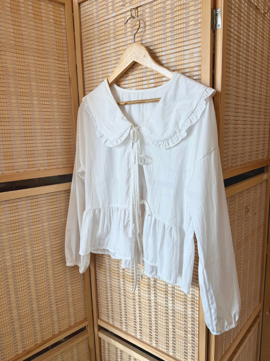White lined crop top with adjustable tie back design.
