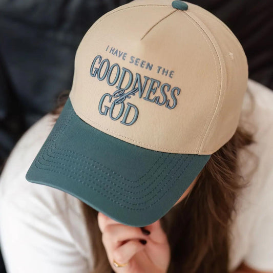 “Teal Embroidered Faith Hat” – Hat on a Bible with soft morning light and a journal nearby

“Goodness of God Hat Close-Up” – Close-up of embroidery and stitching details
