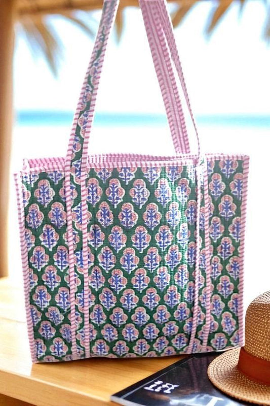 
* "Green quilted tote bag with soft padded texture, handmade by The Makery"
* "Lightweight green quilted tote with stitched detailing and wide handles"
* "The Makery’s green quilted fabric tote bag displayed on a neutral background"
* "Everyday green quilted tote bag with cozy texture and minimalist design"
