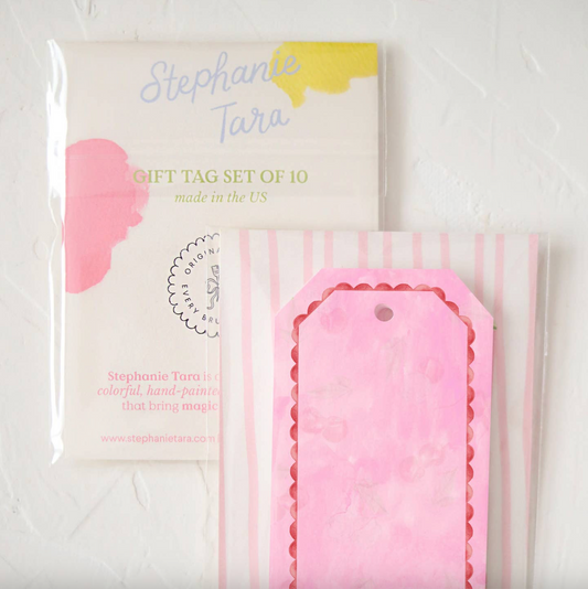 Set of pink gift tags with packaging labeled 'Stephanie Tara' on a white background