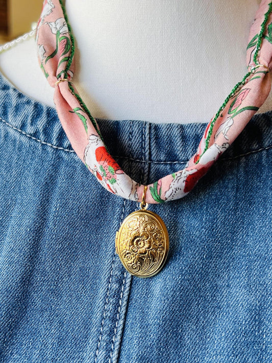 “Locket & Layers” – Close-up of gold locket against colorful bandana cord

“Color Crush” – Necklace styled flat lay with sunglasses and a vintage tee

“Boho Beauty” – Model wearing necklace with flowy top and tousled waves