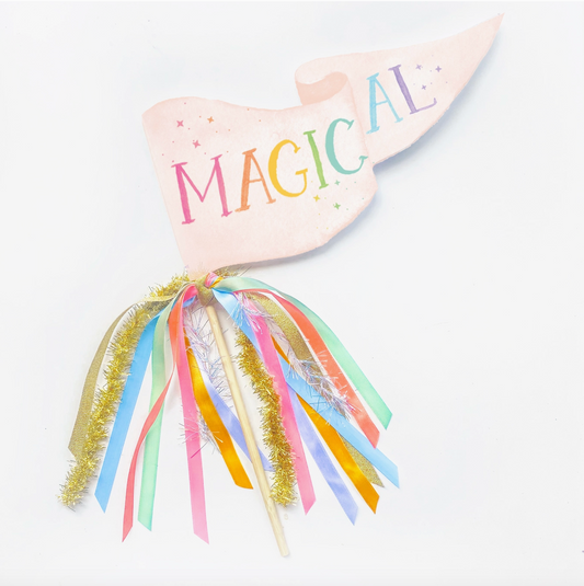 Heart-shaped banner with 'MAGICAL' text and colorful tassels on a white background