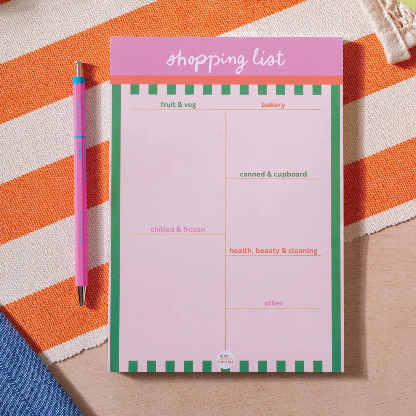 "Rainbow Ready List Pad" – Flatlay of colourful A5 shopping pad with six sections and playful design

"Pretty Plans, Sorted!" – Close-up of handwritten grocery list with pastel pens and organised layout

"Tear. Plan. Conquer." – Side view showing tear-off pages, cardboard back, and eco-friendly paper