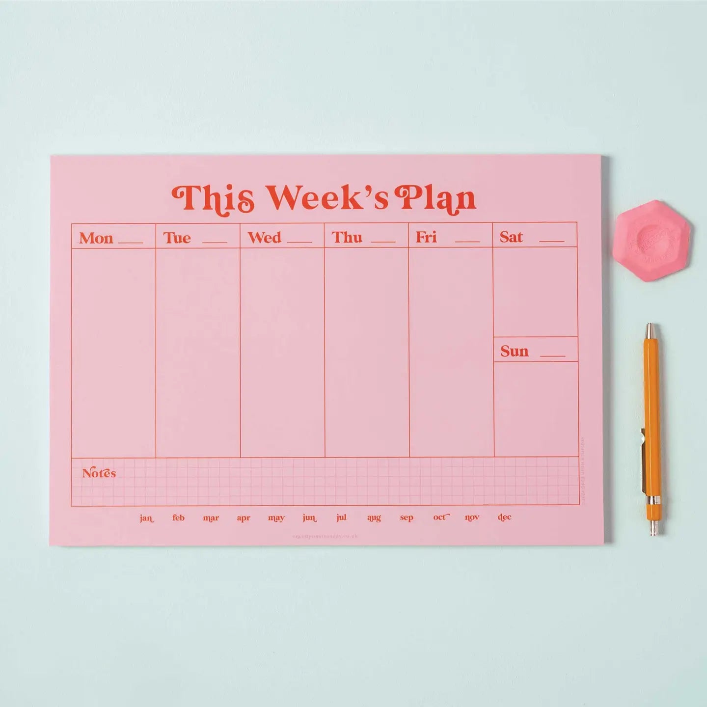 "Wes Anderson Desk Vibes" – Vertical pink + red planner styled with symmetrical desk accessories

"Pen to Paper Perfection" – Close-up of handwritten plans on undated vertical layout

"Plan in Style, Darling" – Flatlay of the planner with pastel pens, coffee, and a film camera