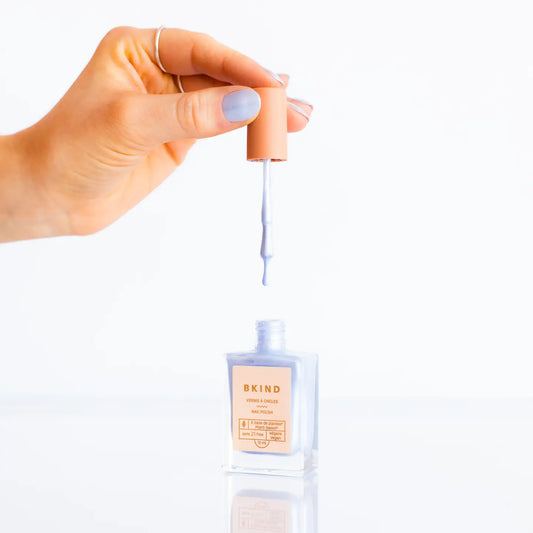 "Frosted Feather Tips" – Bottle of polish styled with pearls and a soft feather on a white silk background

"Swan Queen Nails" – Manicured hand holding a snow globe with subtle shimmer on each nail

"Icy But Make It Kind" – Flatlay of bottle, polish swatches, and icy blue jewelry